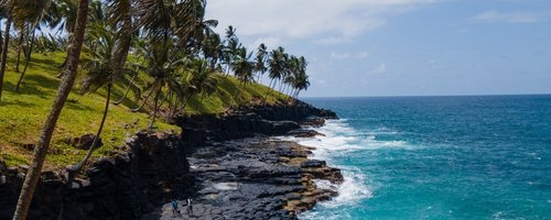 Beautiful views of the coast of the island of sao tome and prince. High waves crashing against the rocks.