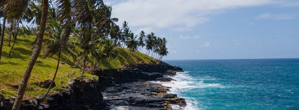 Beautiful views of the coast of the island of sao tome and prince. High waves crashing against the rocks.